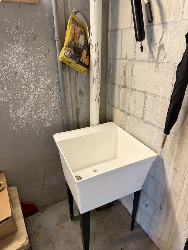 Completed temporary utility sink installation supporting commercial construction jobsite operations